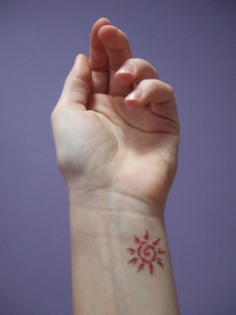 Neringa - Fire sun: real inked placement tattoo photo thumbnail
